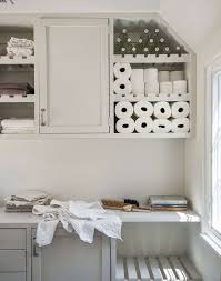 Front hall storage bench with a cushioned top. Laundry And Utility Room Organization