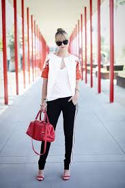 Black And White Striped Shirt With Red Pants I Like The Black Pants With White Stripes On The Sides Fashion Sporty Chic Style Track Pants Outfit