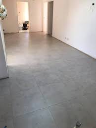 Designers are loving the industrial concrete and cement flooring can be stained any color, stamped, and polished to create a tiled look. A Nice Concrete Look Tiles To Kitchen Dino S Renovations Facebook