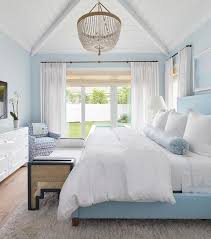 Cathedral ceilings do allow good skylight placement and they do a great job of displaying wood beams inside. Sky Blue Bedroom With White Plank Vaulted Ceiling Cottage Bedroom