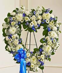 We offer a variety of funeral floral arrangements including funeral bouquets, funeral floral stands and funeral flower wreaths. Blue White Standing Open Heart At From You Flowers