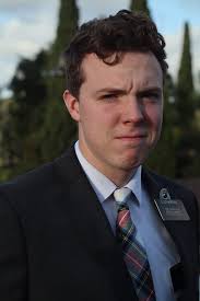 Can someone lighten the middle guy's face?