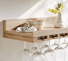 Instead, there are plenty of alternative ideas that will keep your wine in fine condition, as well as on display so they act as a conversation point when guests visit. Holman Handmade Floating Entertaining Shelves Pottery Barn