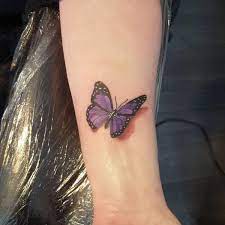 Rather than getting one big tattoo (if you're not into that), try a smattering of smaller tattoos, like this pattern of falling petals and floating butterflies. 3d Butterfly Wrist Tattoo Butterfly Wrist Tattoo Purple Butterfly Tattoo Butterfly Tattoo Designs