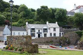 The Swan Inn In St Davids Pembrokeshire This Is A Good Looking Pub Whose Front Door Opens Onto The Sea Wall Above Lit The Swan Inn Pembrokeshire Little Haven