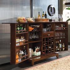 Made from wood in an espresso finish, this cabinet will surprise you with its ample storage space, including a concealed interior with drop front. American Drew Tribecca Flip Top Bar Wine Cabinet Furniture Wine Rack Furniture Home Bar Furniture