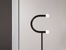 Topped with gleaming glass globes, this floor lamp's slim, sculptural body is captivating from all angles. C Floor Lamp Bower Studios