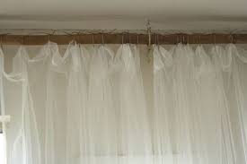 Then bunch up the top layer and knot it to the side. A Creative Way To Hang Curtains And More Barn Photos Diy Curtain Rods Diy Curtains Hanging Curtains