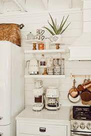 These floating shelves blend so well with their brick stone background that, boasting mostly clear glassware, they nearly disappear. Diy Open Kitchen Shelving Liz Marie Blog