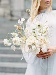 Place a few in a tall vase for a dramatic centerpiece. Dried White Blooms Wedding Florals Lunaria Fine Art Wedding Rachael Ellen Events Modern Wedding Bouquets White Bouquet Wedding Bouquets