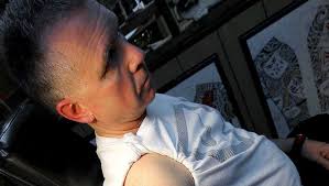 Tattoo artist helps clients profess faith with ink