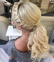 Low Curly Ponytail Hairstyle With A Side Braid Low Ponytail Hairstyles Ponytail Hairstyles Braids For Long Hair