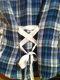 Make A Baggy Lumberjack Style Shirt Have A More Feminine Silhouette Via Safety Pins And A Ribbon To Synch The Back Upcycle Clothes Clothing Hacks Baggy Dresses