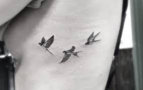 Three Birds In Flight Tattoo Geometric Fine Line Tattoos By La S Famous Dr Woo Neck Tattoo Small Bird Tattoos Bird Tattoo Ribs