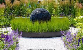 The Dark Planet As The Mysterious Heart Of Slate Grey Design S Best In Show Garden At The Blenheim Flower Sh Garden Design Landscape Plans Landscaping Supplies