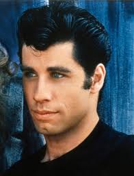 John Travolta (Danny Zuko) was 23. john travolta grease 8 parts of Grease that are really uncomfortable to watch in 2014. Olivia Newton-John (Sandy) was 28 - john-travolta-grease