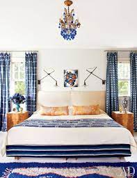 Dark blue grass cloth walls and drapery in an abstract watery blue and ivory pattern lend softness to the space. 26 Bedroom Decorating Ideas How To Decorate A Bedroom Architectural Digest