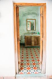 Perfect brass, star light fixture to match the dia de los muertos themed bathroom. Rustic Mexican Bathroom Amazingness Get The Look Justina Blakeney