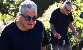 Hear an all new episode of ozzy speaks! Ozzy Osbourne Uses A Cane On Walk Amid His Battle With Parkinson S Disease Daily Mail Online