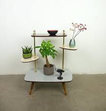 It is complemented by a round base that is connected to the top via the the open design bases of these sleek and stylish nesting tables allow then to be nested together when not in use. German Multicolored Side Table 1950s For Sale At Pamono