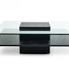 The turned legs and bottom shelf feature a matte black finish with the round top in. 1
