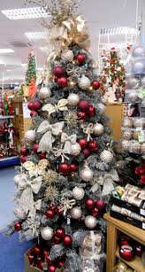 Small worlds is an ongoing series of 3d cad designed posters, each detailing a theme in a small world, the first is champagne christmas. Champagne Burgundy Coloured Tree Decorations On An Iced Effect Green Tree Red Christmas Decor Christmas Tree Colour Scheme Holiday Christmas Tree