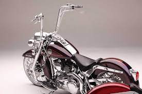 Its handlebar is shaped more. This 2000 Harley Davidson Heritage Softail And 2008 Softail Deluxe Are Two Examples Of The Fine Wo Harley Bikes Custom Motorcycles Harley Harley Softail Deluxe