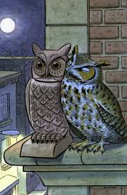 owl snuggling up to decoy owl