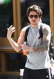 He has two complete sleeves on his arms, containing numerous japanese tattoo designs, including mostly flowers and fish. John Mayer Tattoos Lookbook Stylebistro