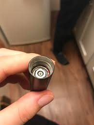 How do I remove the battery from this vibrator? It is stuck and cant be  removed by pulling with tweezers or violent shaking. : rhowto
