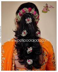 Modern Hair Flowers To Complete Your Engagement Reception Look Flowers By Mallika P Indian Bride Hairstyle South Indian Wedding Hairstyles Saree Hairstyles