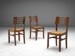 1940s decor — 32 pages of designs and ideas from 1944. Set Of Four Dining Chairs By Pierre Cruege In Oak And Cane France 1940s Dining Chairs Dining Room Chairs Modern Fabric Dining Room Chairs
