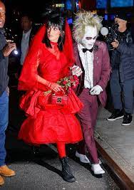 This is outstanding and so well executed. All The Spooky And Spectacular Costumes Celebs Wore For Halloween Celebrity Couple Costumes Beetlejuice Costume Couples Costumes