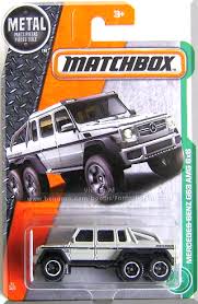 Beige W No Interior Blackout Windows Black Stripe Along Sides Silver Black V8 Biturbo Badge On Front Fende Hot Wheels Garage Hot Wheels Toys Hot Wheels