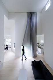 This monochromatic palette is simultaneously conventional and revolutionary. Small House Big Impact With Black Facade White Interiors