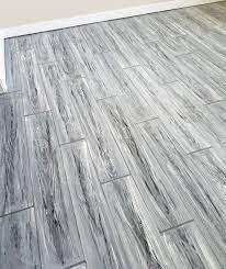I Painted My Concrete Floors To Look Like 6x36 Wood Grain Tile Planks Painted The Base Coat Then Used 4 Wood Grain Tile Concrete Floors Diy Concrete Floors