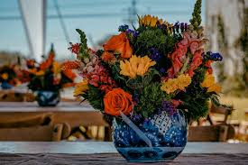 Pebbles and greenery have been placed in bottom of the vase to give the appearance of. Yellow Orange And Pink Flower Arrangement In Blue Floral Vase Photo Free Plant Image On Unsplash