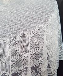 These round tablecloths are seamless (crafted from a single piece of polyester fabric) and feature serged edges for extra durability. Amazon Com Fine White Lace Tablecloth In 90 Round Floral Design Perfect For Wedding Reception And Party 90 Inches Kitchen Dining