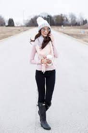 Blush Pink Winter Outfit With A White Pompom Hat Black Matte Hunter Boots And A Pastel Colo Rainy Day Outfit For Spring Scarf Casual Rainy Day Outfit For Fall