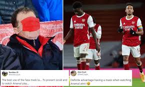 England soccer player harry maguire leaves the court after pleading not guilty to all charges. One Arsenal Fan Finds A New Use For Face Masks At Football Covering His Eyes From Seeing Team Lose Daily Mail Online
