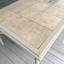 It's usually a sturdy and durable structure that, once built, can last for many 7. Tile Top Patio Table Makeover Chica And Jo