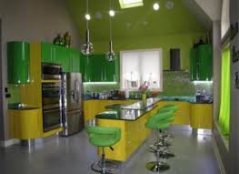 This kitchen benefits from rustic weathered green cabinets that compliment the granite countertops and the farmhouse sink. Modern Yellow And Green Kitchen Novocom Top