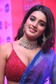 A saree (sometimes spelled sari, or shari) is an article of clothing originating and widely worn sarees are incredibly sexy, and they only serve to enhance the beauty of the girls who are wearing them. Pin On Nidhi Agarwal