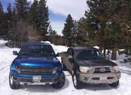 A used gen2 raptor is going to be in the shop about 100x as often as a new tacoma, some people value a machine that will always work. Raptor Rescue 2015 Toyota Tacoma Trd Vs F 150 Raptor Snowy Misadventure Video The Fast Lane Truck