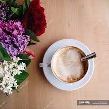 Find images of coffee flower. Overhead View Of Coffee And Flowers On Table Refreshment Peonies Stock Photo 193559190