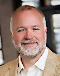 Wetmore wants to make key hires. Moss wants to name him interim  administrator.