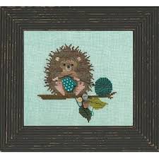 The pattern was stitched on 14 count white aida cloth, it is pictured in a six inch wooden hoop. Just Another Button Company Woodland Whimsy Series 2 Woodland Hedgehog Cross Stitch