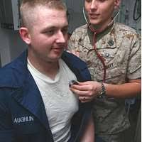 Engineman 1st Class Brandon Lovell is fitted for his new chief petty  officer (CPO) uniform at the Navy Exchange in Arlington, Va., during Sailor  of the Year Week.