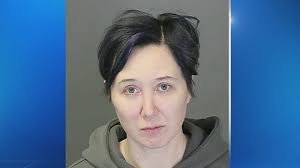 Woman accused of stealing donations from slain woman's children