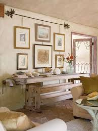 A picture rail is the perfect way to inexpensively fill a large, empty wall! Hanging Art On A Picture Rail